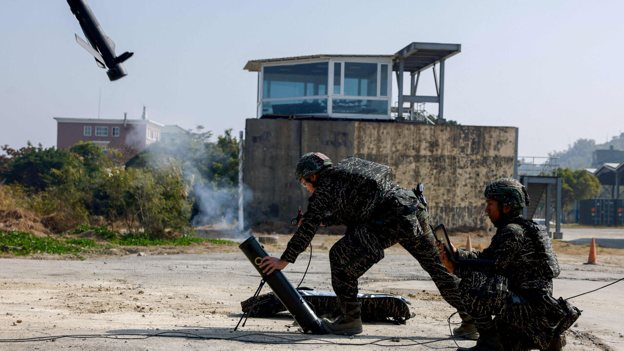 FILE PHOTO: Soldiers operate a Taiwan-made attack drone during an annual military exercise ahead of the Lunar New Year, in Kaohsiung, Taiwan, January 29, 2026. REUTERS/Ann Wang/File Photo
