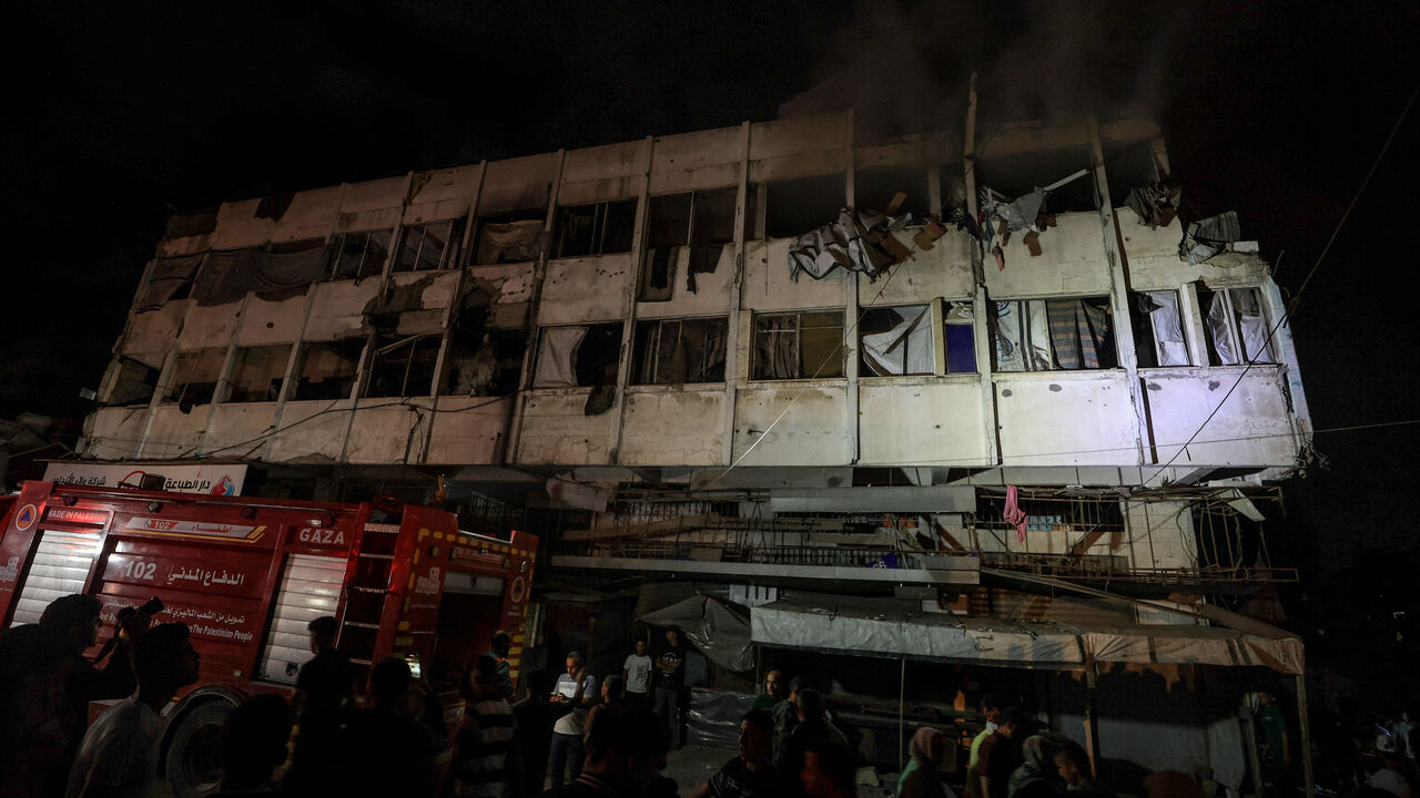 Palestinians gather at the site of an Israeli strike on a residential building in Gaza City, May 27, 2026. REUTERS/Dawoud Abu Alkas