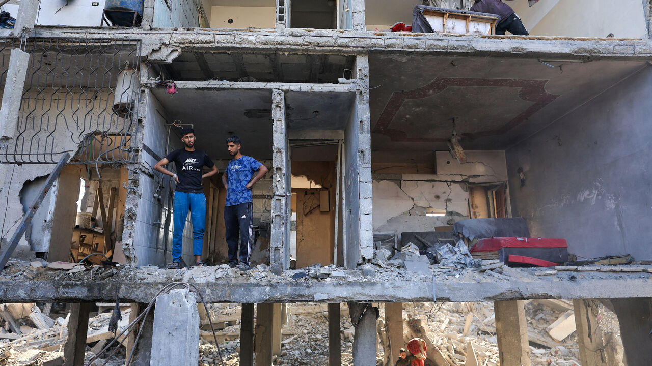 Palestinians inspect the site of an Israeli strike on a house, which was pre-warned by the Israeli military to evacuate before the strike was carried out late on Thursday, at Shati (Beach) refugee camp in Gaza City, May 29, 2026. REUTERS/Dawoud Abu Alkas