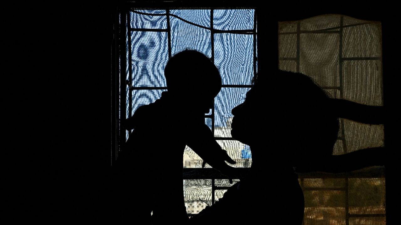 I would never let him go: a Sudanese rape survivor holds her child