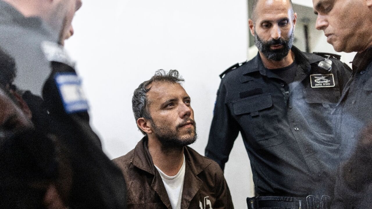 Brazil's activist Thiago Avila is escorted into court in the Israeli coastal city of Ashkelon