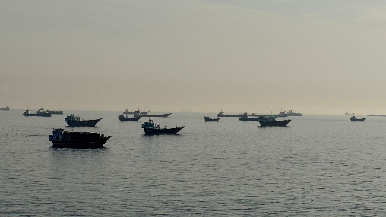 Vessels are seen anchored in the Strait of Hormuz, off the port city of Khasab on Oman's northern Musandam Peninsula on May 17, 2026