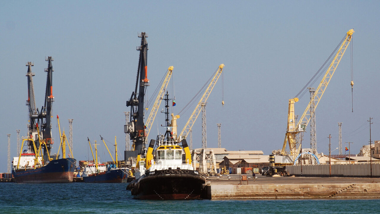 TO GO WITH STORY by Peter Martell: "Eritrea-economy-port": A couple of boats and two tug boats can be seen in Eritrea's Red Sea port of Massawa on November 18, 2007. Once one of East Africa's busiest ports, the town is still recovering after being badly bombed in 1990 during Eritrea's war of liberation from Ethiopia. The government is trying to revitalize the port, but efforts are hampered by a sluggish economy and threat of a renewed conflict with Ethiopia. AFP PHOTO/Peter MARTELL (Photo credit should read