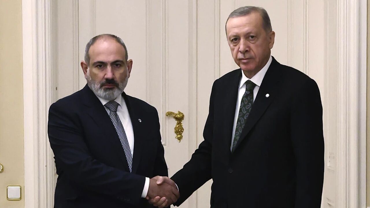 Turkey’s President Recep Tayyip Erdogan, right, and Armenia’s Prime Minister Nikol Pashinyan shake hands before a meeting at Prague Castle in Prague, Czech Republic, Thursday, Oct. 6, 2022.