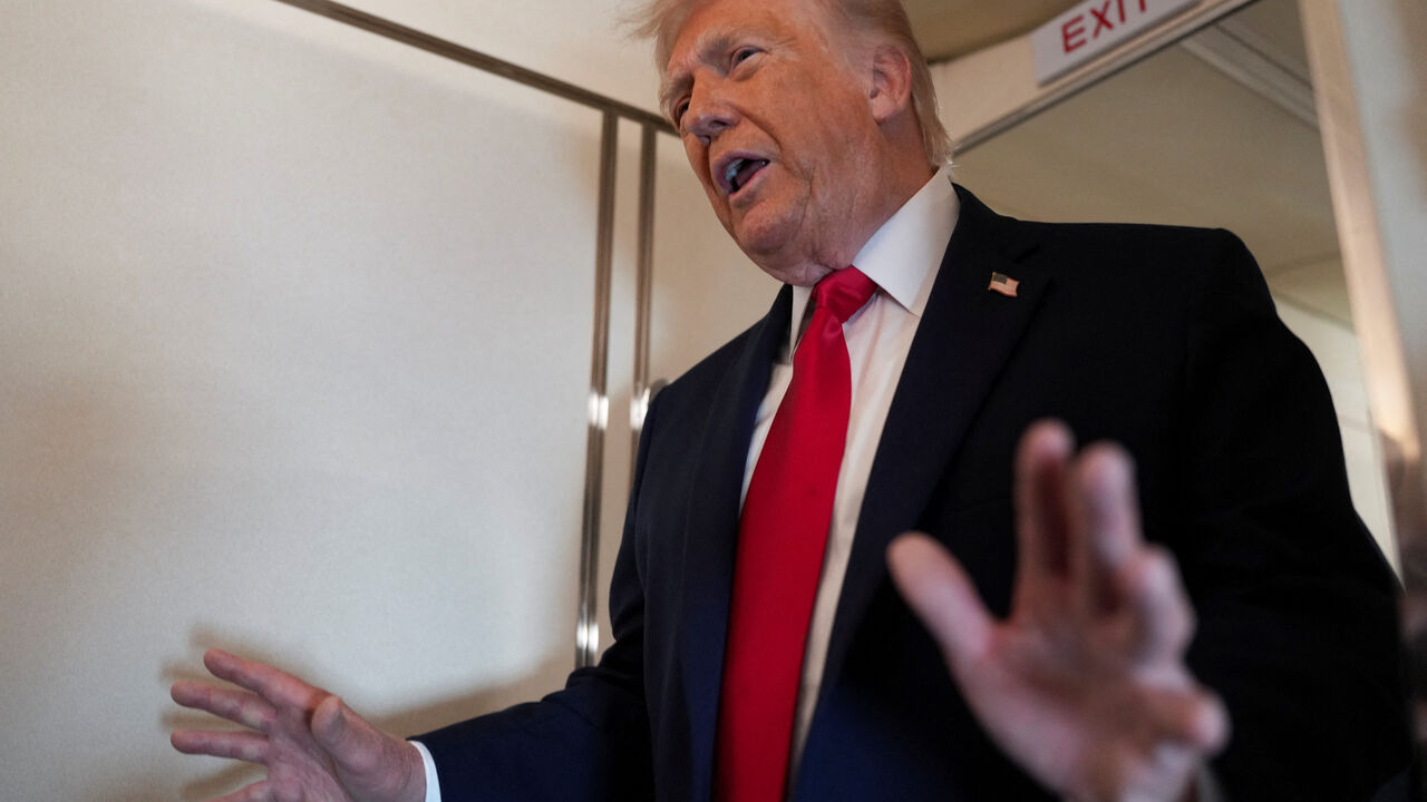 FILE PHOTO: U.S. President Donald Trump speaks to members of the media on board Air Force One while flying from Joint Base Andrews to Chippewa Valley Regional Airport in Eau Claire, Wisconsin, U.S., June 5, 2026. REUTERS/Nathan Howard/File Photo