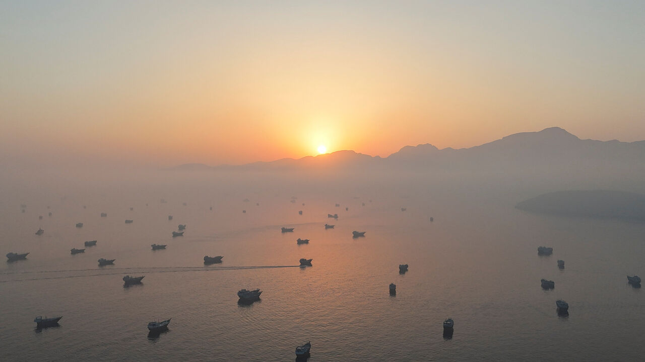 A drone view shows vessels in the Strait of Hormuz, as seen from Musandam, Oman, June 15, 2026. REUTERS/Stringer
