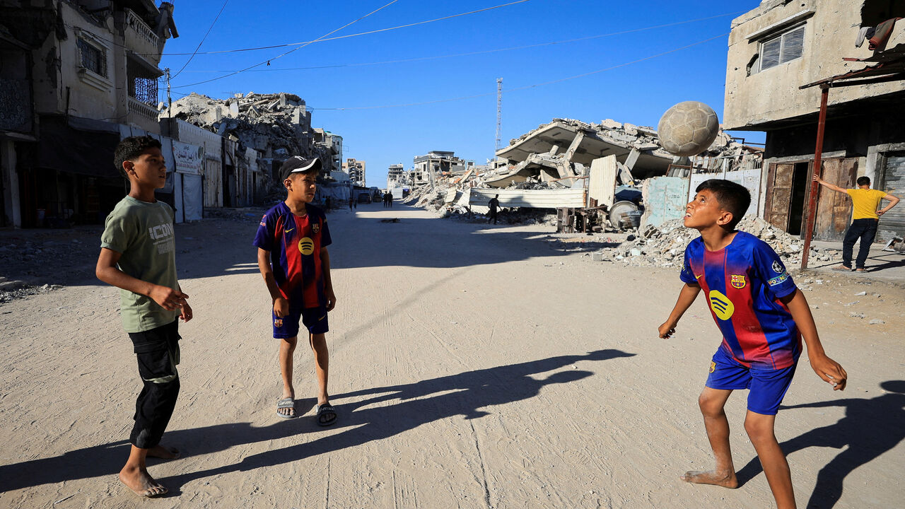 FILE PHOTO: Palestinian children play soccer on a street in Gaza City, June 13, 2026. REUTERS/Dawoud Abu Alkas/File Photo