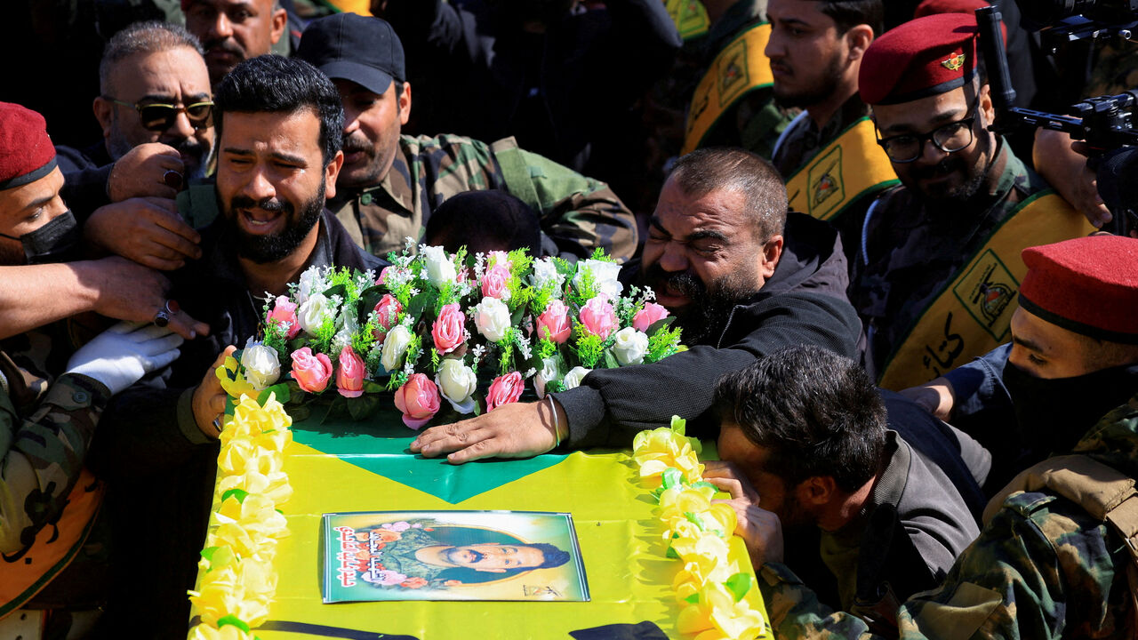 FILE PHOTO: Mourners attend the funeral procession of Ali Hassan Abdullah, a commander from Islamic Resistance in Iraq, and people who were accompanying him and were killed in an airstrike that targeted their vehicle south of Baghdad, according to police sources, in Baghdad, Iraq, March 5, 2026. REUTERS/Thaier Al-Sudani/File Photo
