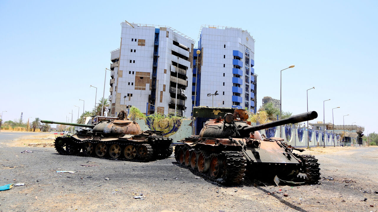 FILE PHOTO: A view of damaged tanks in front of the Central Bank of Sudan building, after the Sudanese army deepened its control over Khartoum from the Rapid Support Forces (RSF), in Khartoum, Sudan April 27, 2025. REUTERS/El Tayeb Siddig/File Photo