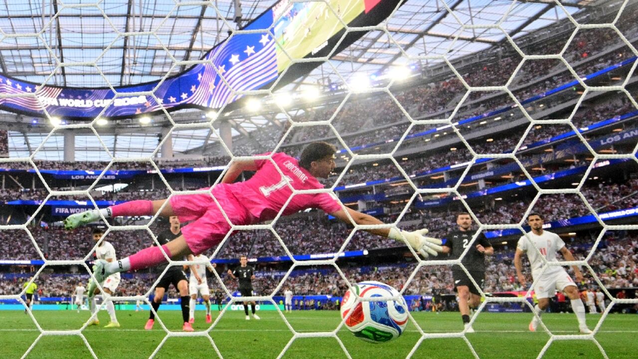Iran midfielder Mohammad Mohebbi scores his team's second equaliser in a 2-2 draw with New Zealand in World Cup Group G