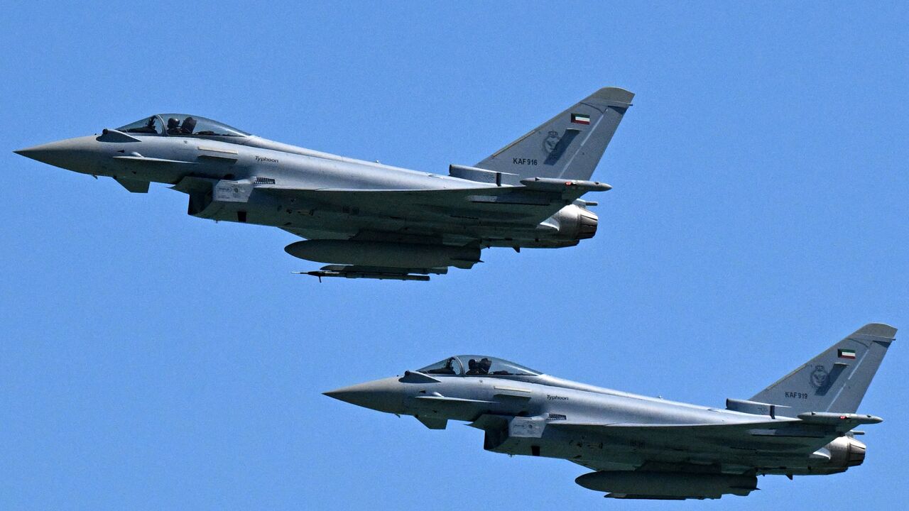 Kuwaiti Air Force Eurofighter Typhoon fighter aircraft fly over during an airshow commemorating Kuwait's 64th Independence Day in Kuwait City on Feb. 25, 2025. 