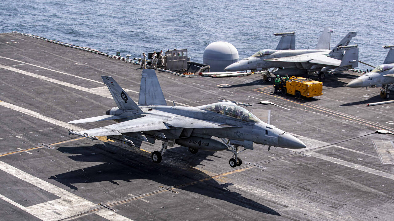 In this US Navy released handout, an F/A-18F Super Hornet, attached to Strike Fighter Squadron (VFA) 41, makes an arrested landing on the flight deck of Nimitz-class aircraft carrier USS Abraham Lincoln in support of Operation Epic Fury, Feb. 28, 2026