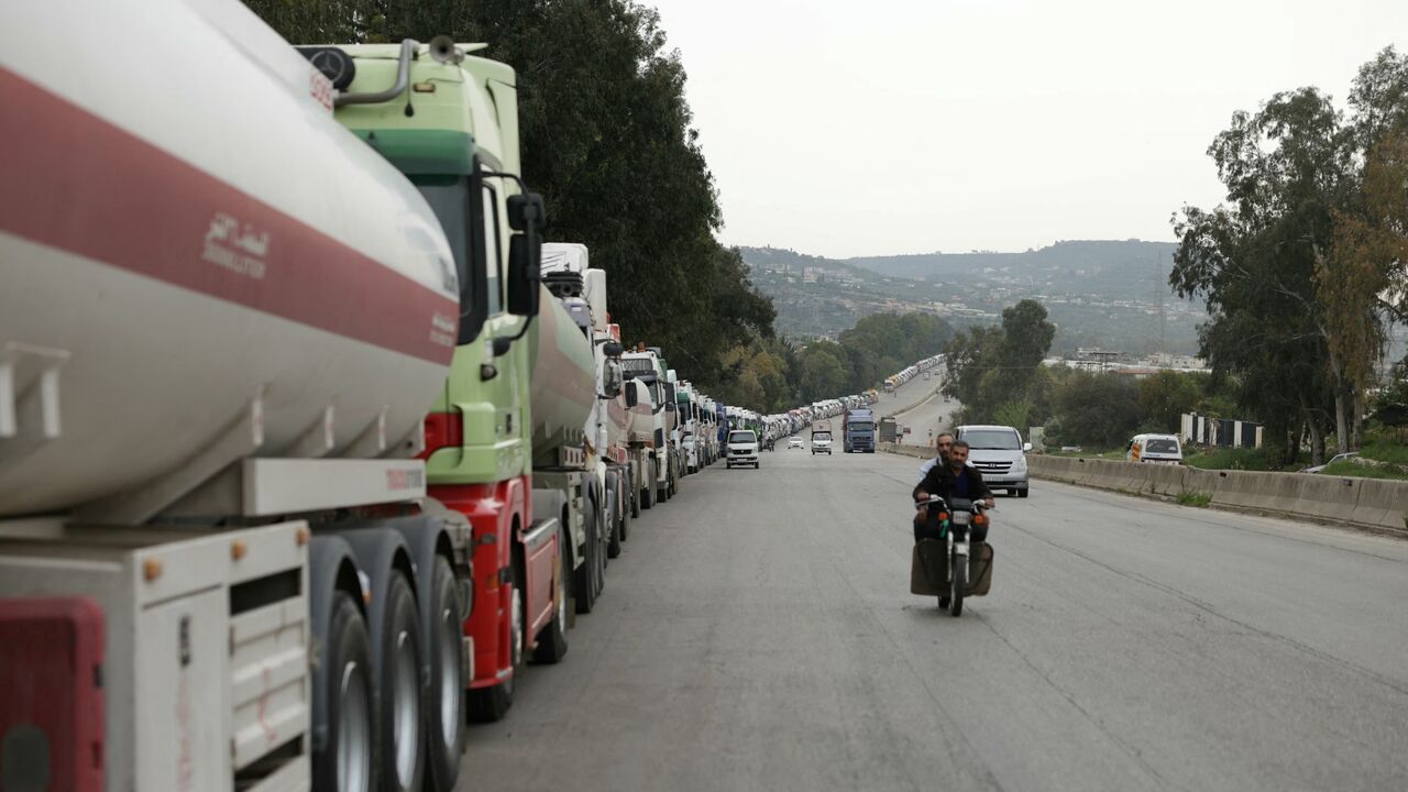A long convoys of Iraqi diesel-laden tanker trucks line up along the highway Tartus-Baniyas highway as they wait to unload their cargo at the Baniyas port refinery on the Mediterranean Sea, on April 15, 2026.