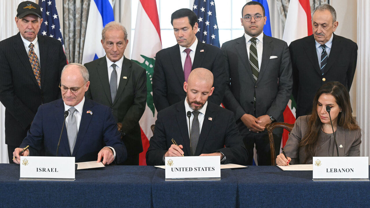 US Secretary of State Marco Rubio (C, back) looks on as (L/R, front row) Israeli Ambassador to the US Yechiel Leiter, State Department Chief of Staff Daniel Holler, and Lebanese Ambassador to the US Nada Hamadeh sign a framework agreement at the US Department of State in Washington, DC, on June 26, 2026. Lebanon, Israel and the United States on Friday signed a trilateral framework agreement aimed at paving the way for a peace deal between the two long-time Middle East adversaries. (Photo by SAUL LOEB / AFP 