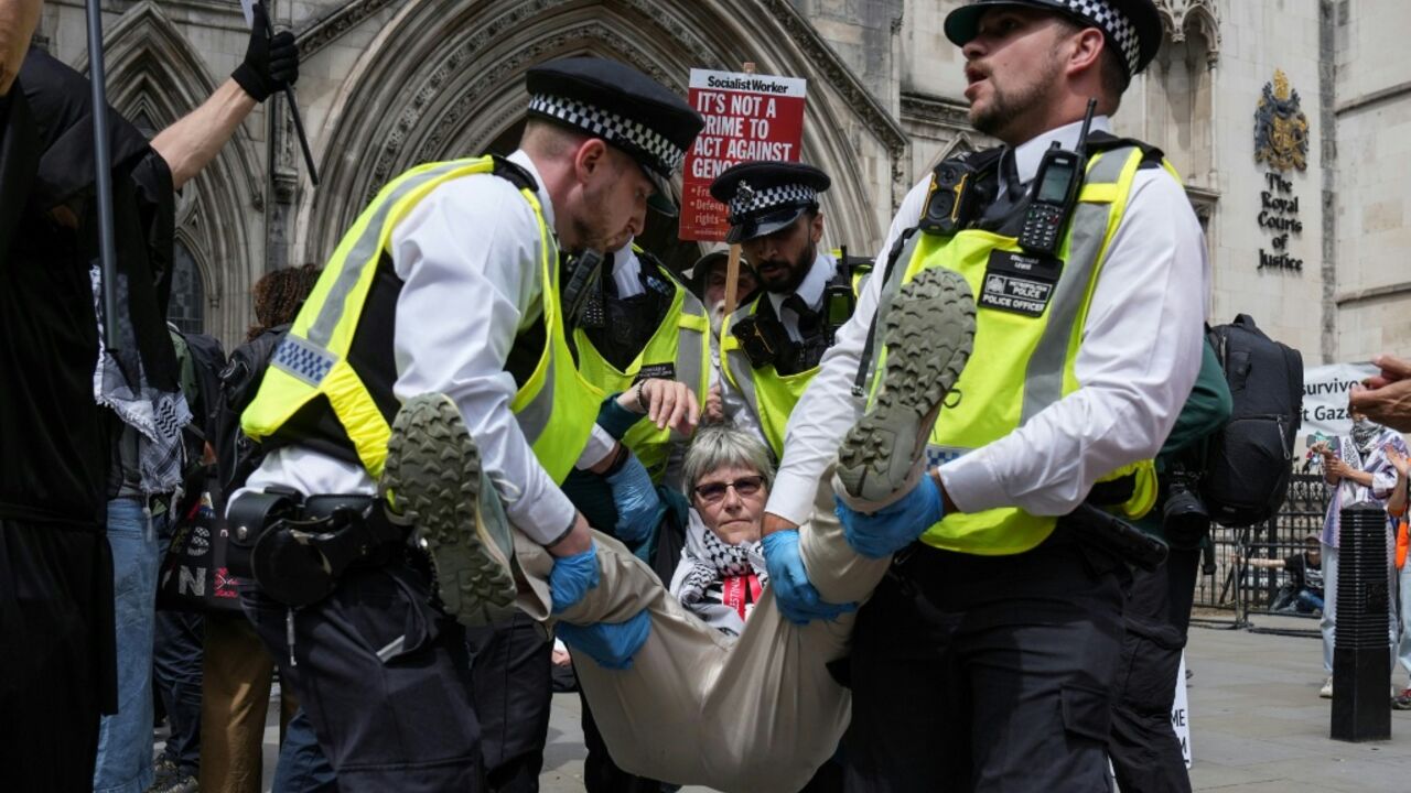 Police remove protesters from outside the Royal Courts Of Justice in central London in June