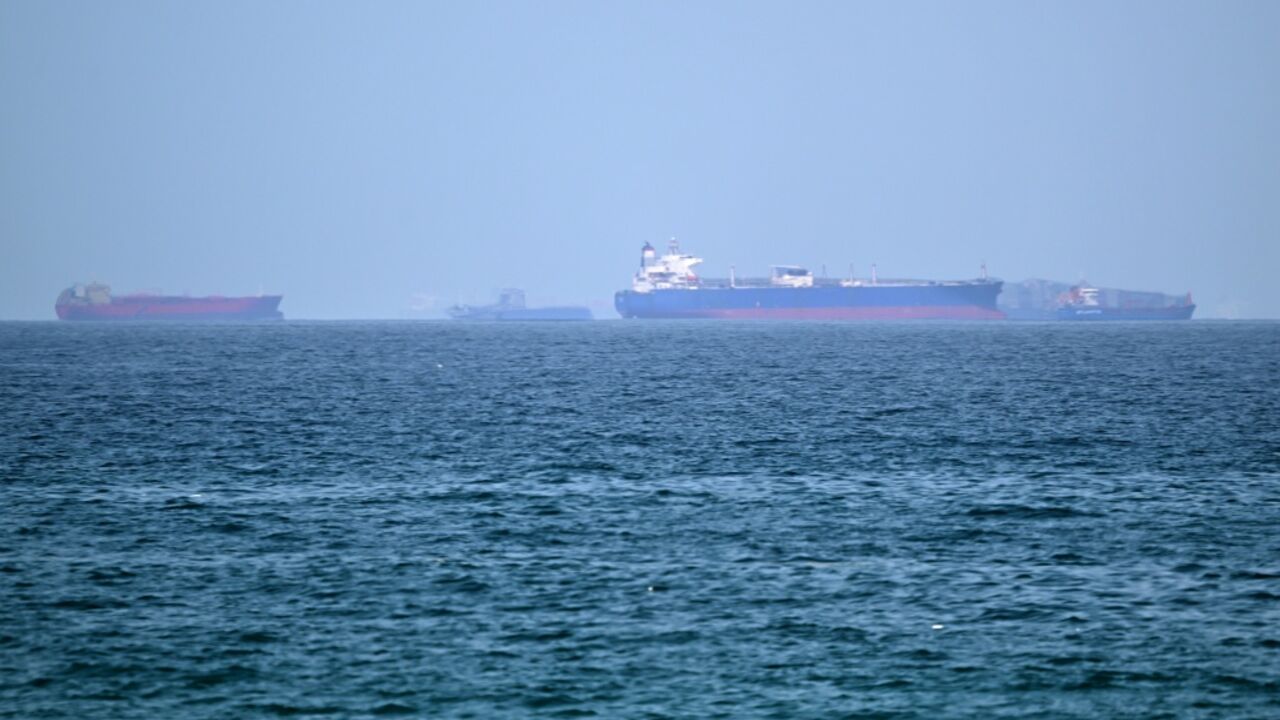 Vessels are pictured off the coast of the Khor Fakkan Container Terminal, a major UAE container port near Oman, in the same region where three tankers were struck
