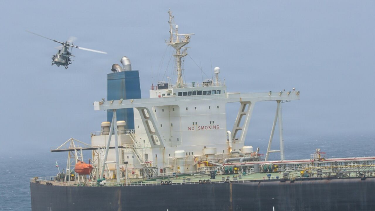 A US Marine Corps handout showing Marines boarding a ship, M/T Wen Yao, in the Gulf of Oman on Thursday as part of America's revived blockade of Iranian ports