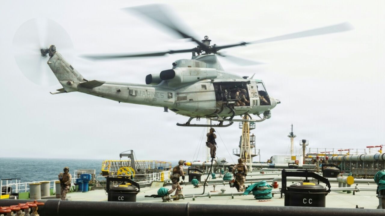This US Marine Corps handout photograph taken on July 16, 2026, by US Central Command Public Affairs reportedly shows US Marines from the 11th Marine Expeditionary Unit conducting a verification boarding aboard M/T Wen Yao in the Gulf of Oman.