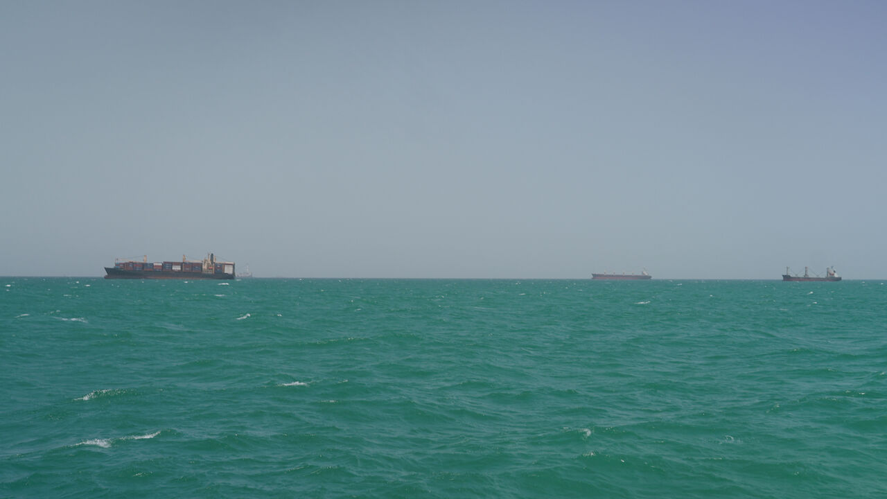 FILE PHOTO: Cargo ships sail in Saudi waters near the Dammam Port in Dammam, Saudi Arabia, May 17, 2026. REUTERS/Mohammed Benmansour/File Photo