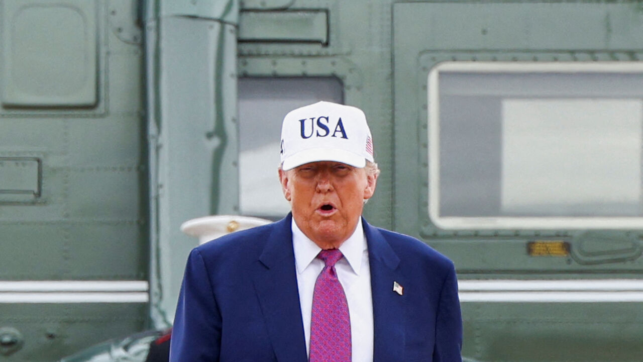 U.S. President Donald Trump steps out of Marine One for a visit to Fort Bragg to mark the U.S. Army anniversary, in North Carolina, U.S., June 10, 2025. REUTERS/Evelyn Hockstein     TPX IMAGES OF THE DAY