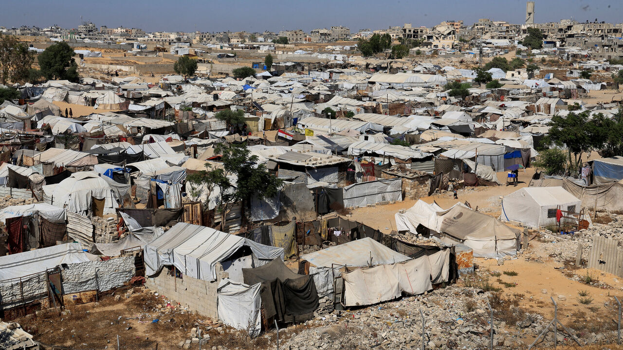 FILE PHOTO: Displaced Palestinians shelter at a tent camp in Khan Younis, southern Gaza Strip, July 8, 2026. REUTERS/Haseeb Alwazeer/File Photo