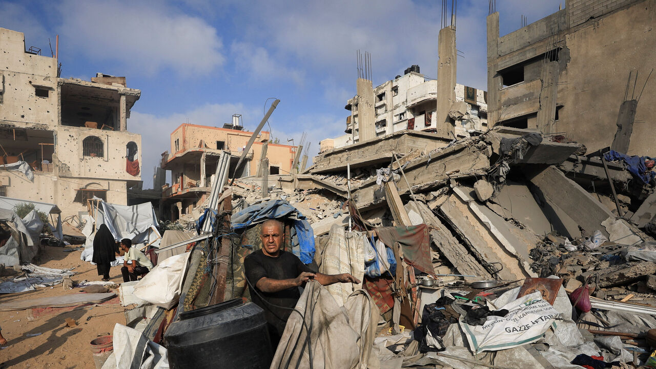 A Palestinian man inspects the site of Wednesday's Israeli strike on a house whose residents were pre-warned by the Israeli military to evacuate, in Gaza City, July 30, 2026. REUTERS/Dawoud Abu Alkas
