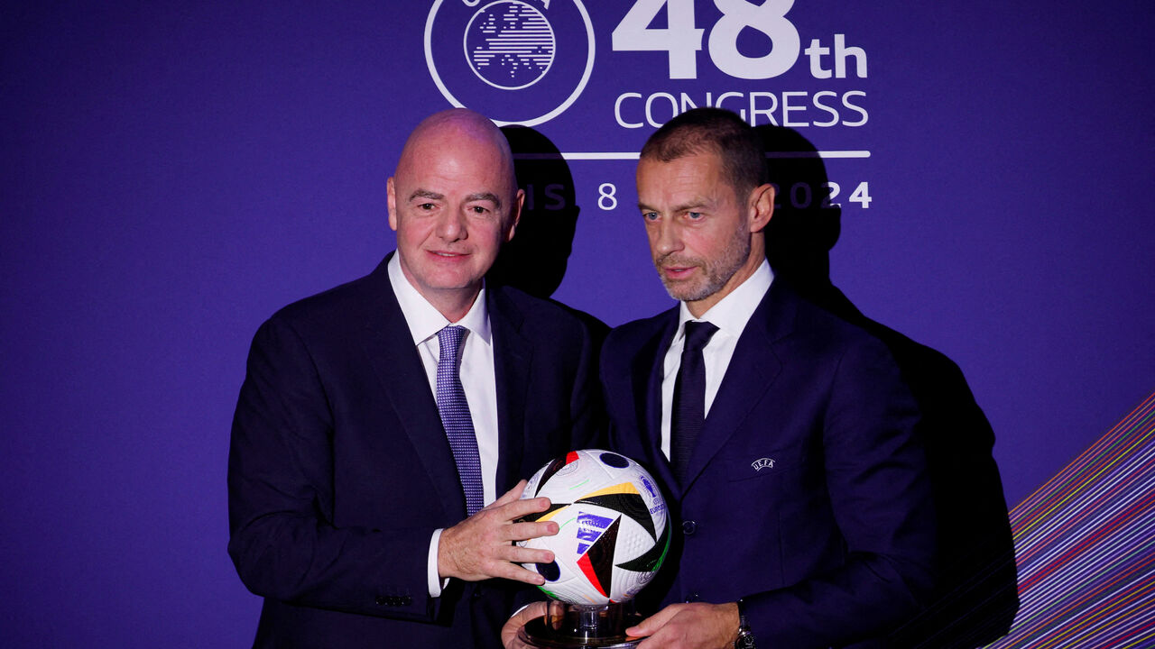 FILE PHOTO: Soccer Football - UEFA Congress - Maison de la Mutualite, Paris, France - February 8, 2024 FIFA president Gianni Infantino and UEFA president Aleksander Ceferin during the UEFA Congress REUTERS/Gonzalo Fuentes/File Photo