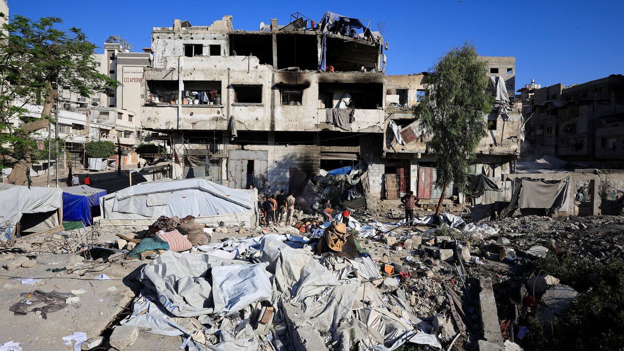 Palestinians inspect the damage at the site of an Israeli strike on Wednesday in Gaza City, May 28, 2026. REUTERS/Dawoud Abu Alkas