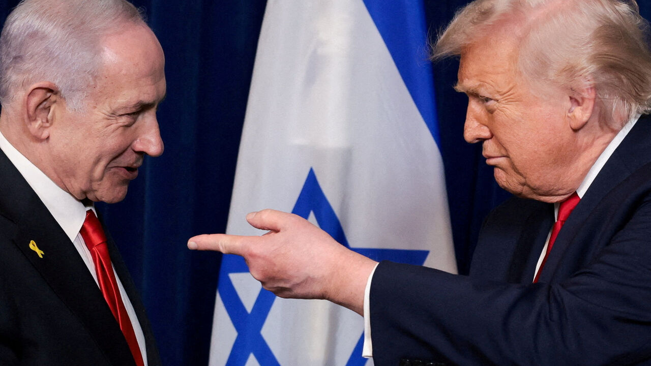 FILE PHOTO: U.S. President Donald Trump points his finger towards Israeli Prime Minister Benjamin Netanyahu during a press conference after meeting at Trump’s Mar-a-Lago club in Palm Beach, Florida, U.S., December 29, 2025. REUTERS/Jonathan Ernst/File Photo