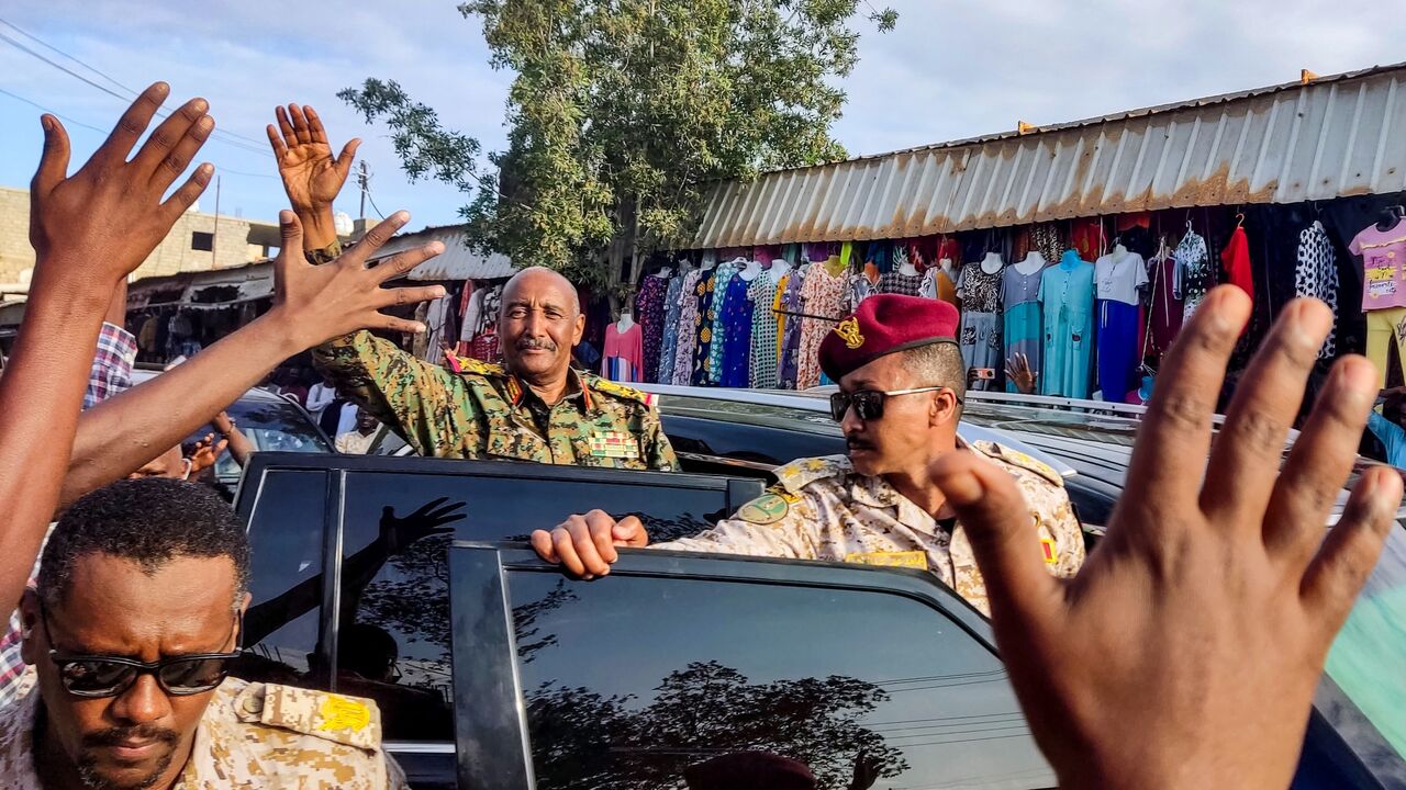 Sudan's de facto leader and armed forces chief Abdel Fattah al-Burhan greets supporters in Port Sudan, Dec. 29, 2024.