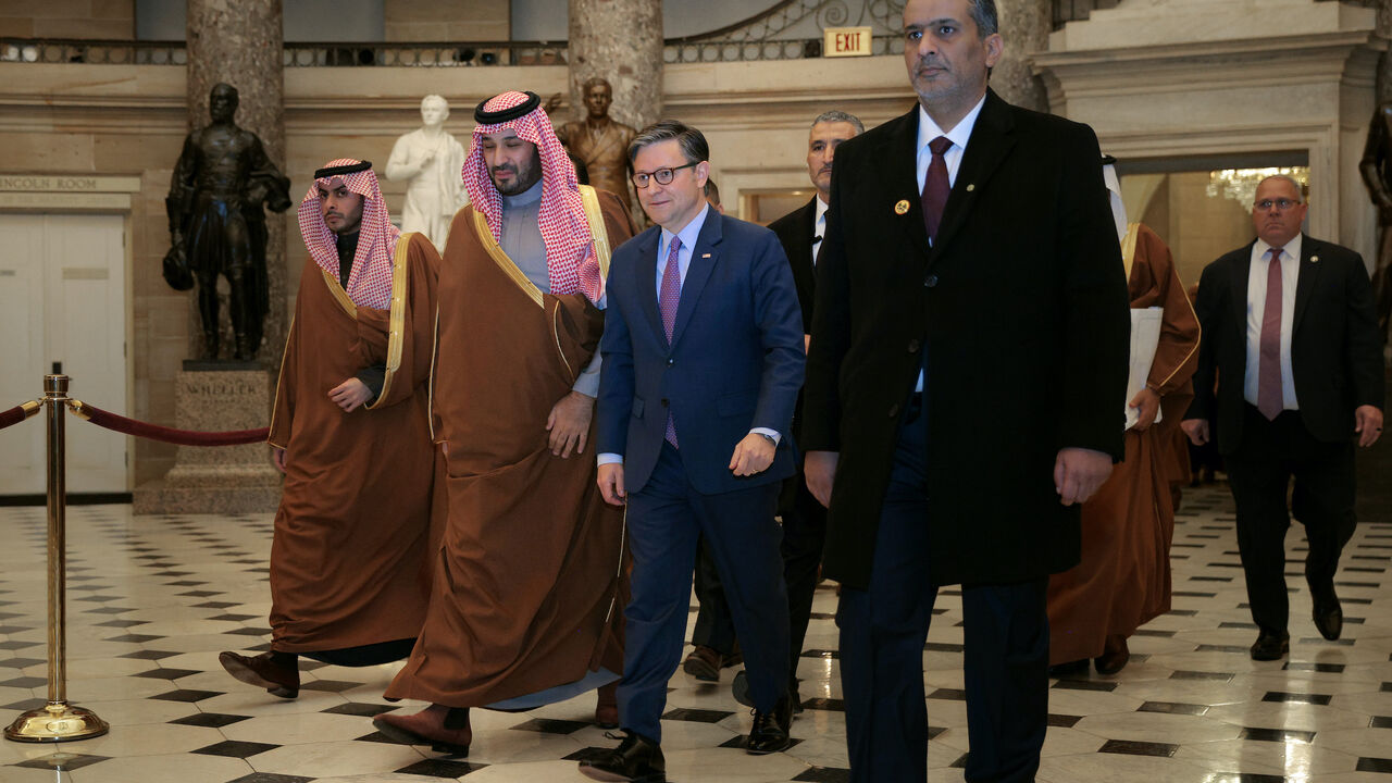 Crown Prince and Prime Minister Mohammed bin Salman of Saudi Arabia (2nd L) is escorted by Speaker of the House Mike Johnson (R-LA) through Statuary Hall as they head to a meeting at the U.S. Capitol on Nov. 19, 2025 in Washington, DC. 