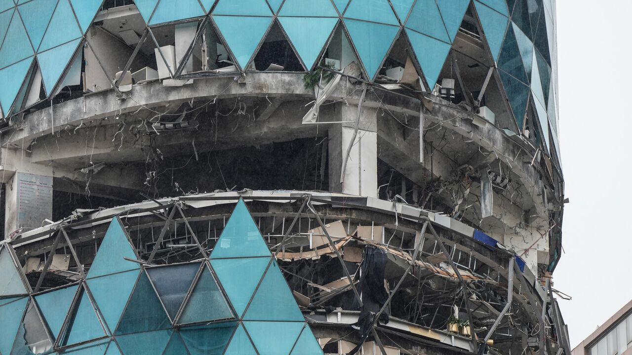 A photograph shows a damaged building in the aftermath of a drone strike in the Seef district of Manama on March 10, 2026. 