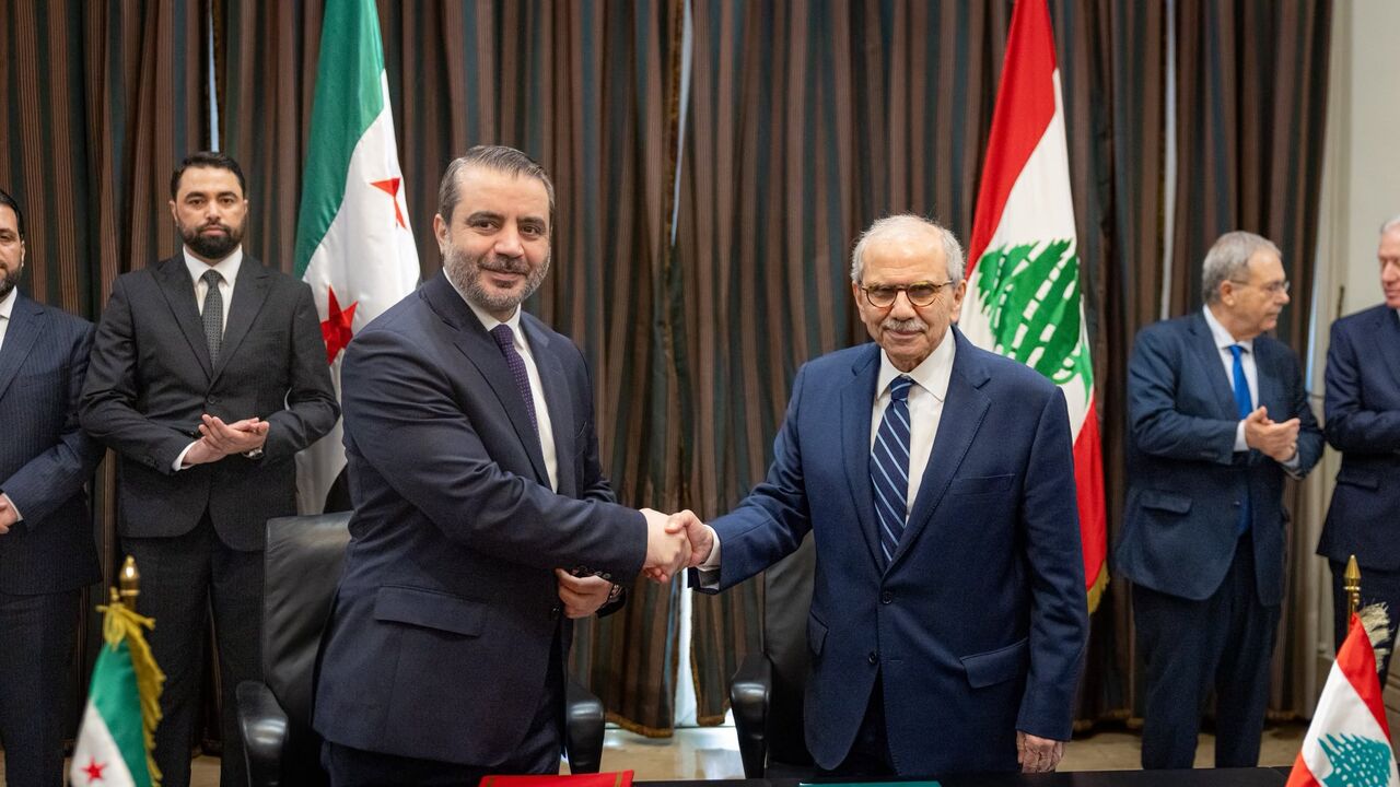 Nawaf Salam and Asaad al-Shibani shake hands in Beirut on July 2, 2026. 