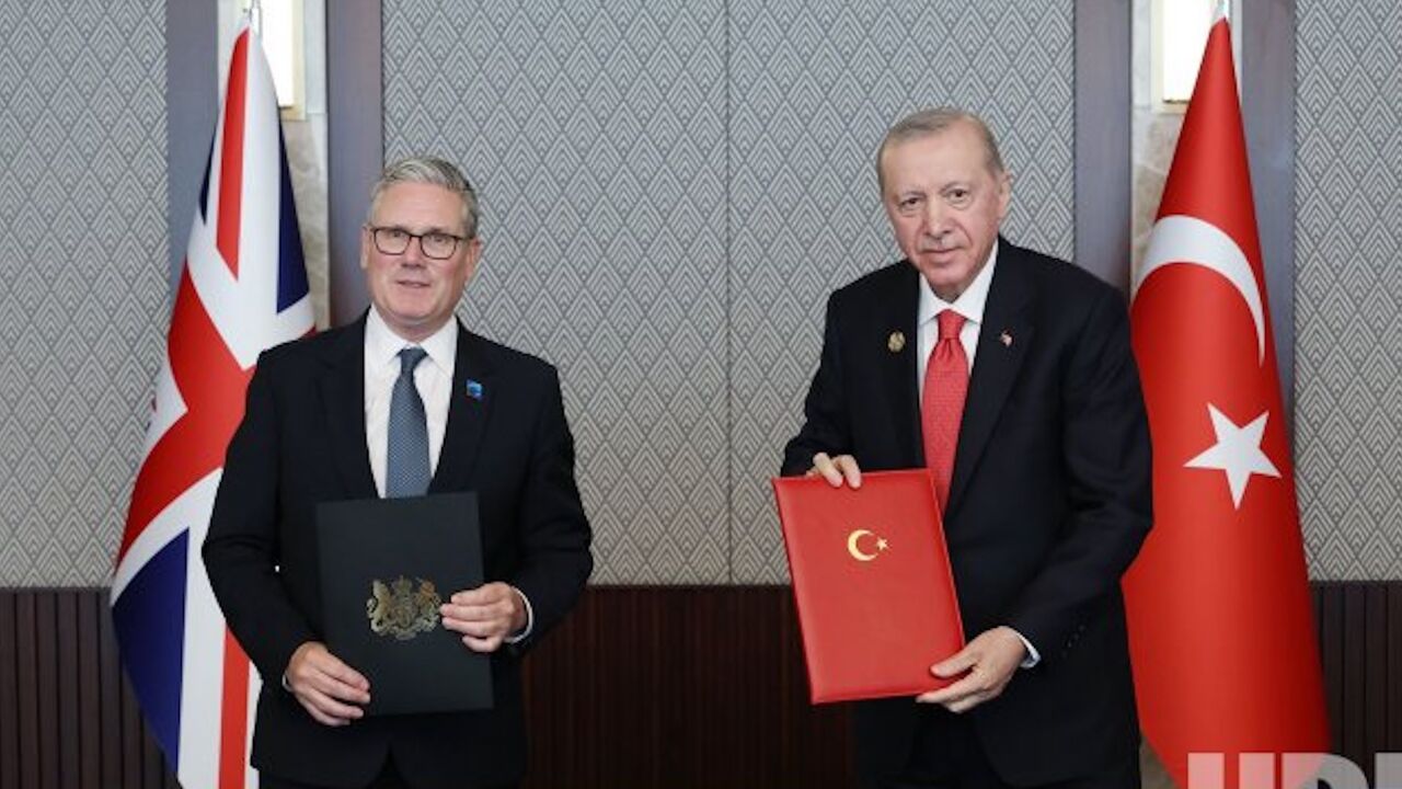 Britain's Prime Minister Keir Starmer (L) and Turkish President Recep Tayyip Erdogan pose after signing a defense partnership agreement on the sidelines of the NATO summit in Ankara, Turkey, Wednesday, July 8, 2026. 