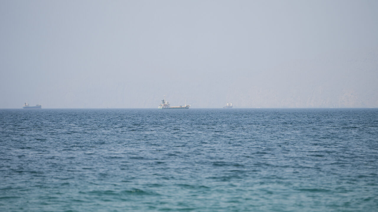 Vessels near the Strait of Hormuz, as seen from Musandam, Oman, August 6, 2026. REUTERS/Stringer