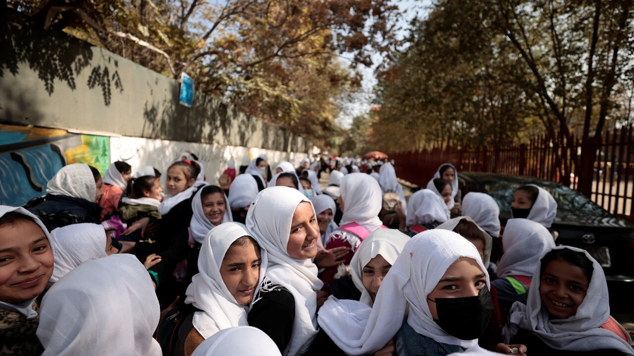 FILE PHOTO: Female primary school students leave school after a class in Kabul, Afghanistan, October 25, 2021. REUTERS/Zohra Bensemra/File Photo