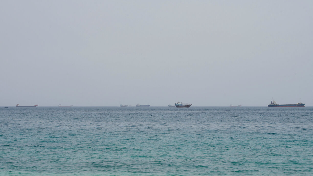 Vessels near the Strait of Hormuz, as seen from Musandam, Oman, August 10, 2026. REUTERS/Stringer