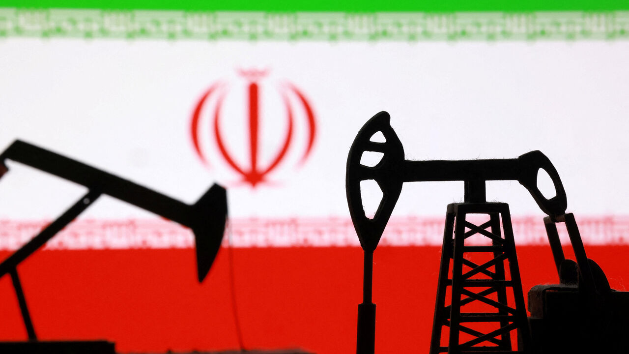 3D-printed oil pump jacks and an Iranian flag appear in this illustration taken March 2, 2026. REUTERS/Dado Ruvic/Illustration