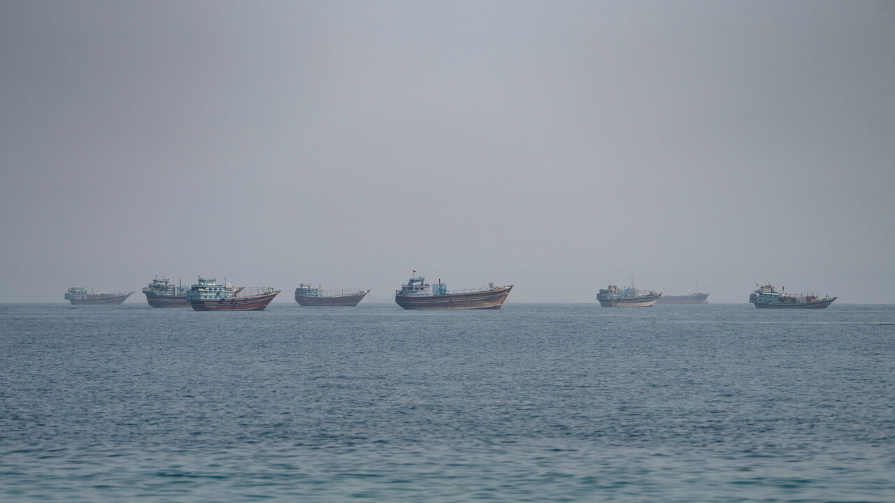 Vessels near the Strait of Hormuz, as seen from Musandam, Oman, August 24, 2026. REUTERS/Stringer