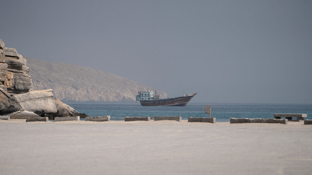 A vessel near the Strait of Hormuz, as seen from Musandam, Oman, August 24, 2026. REUTERS/Stringer