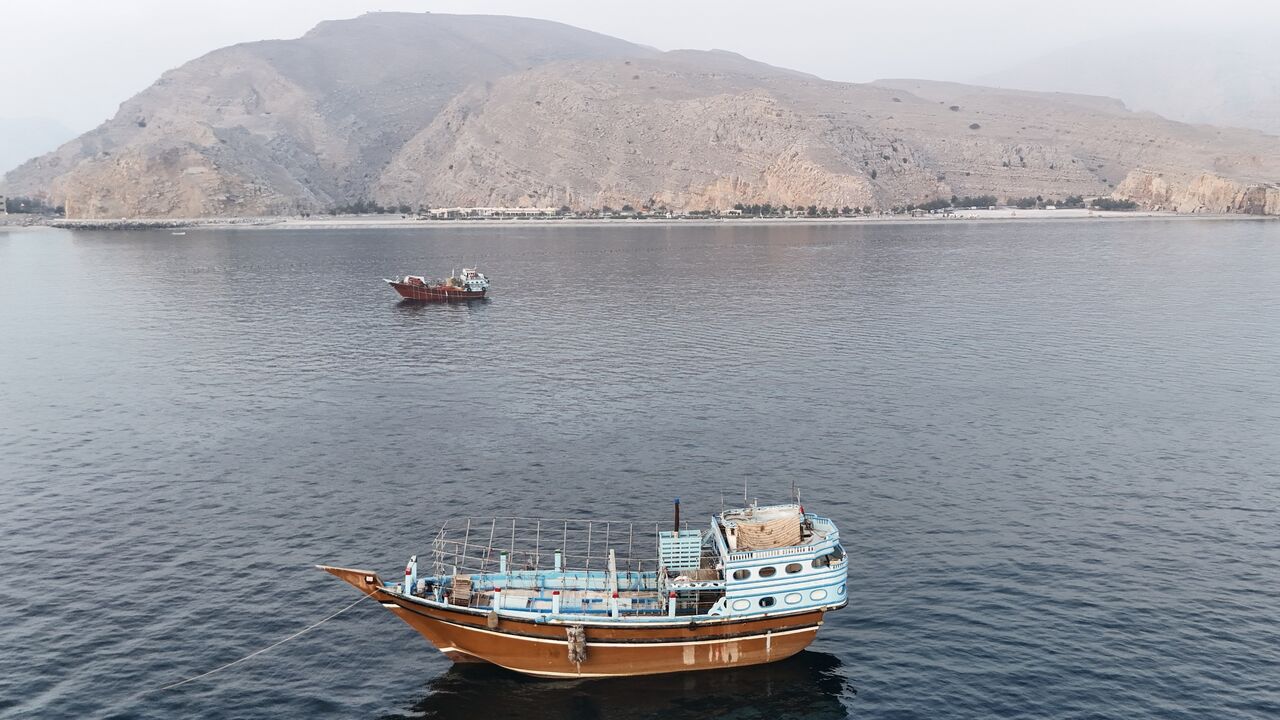 This aerial photograph shows boats anchored off Oman's northern Musandam Peninsula near the Strait of Hormuz on June 27, 2026. 