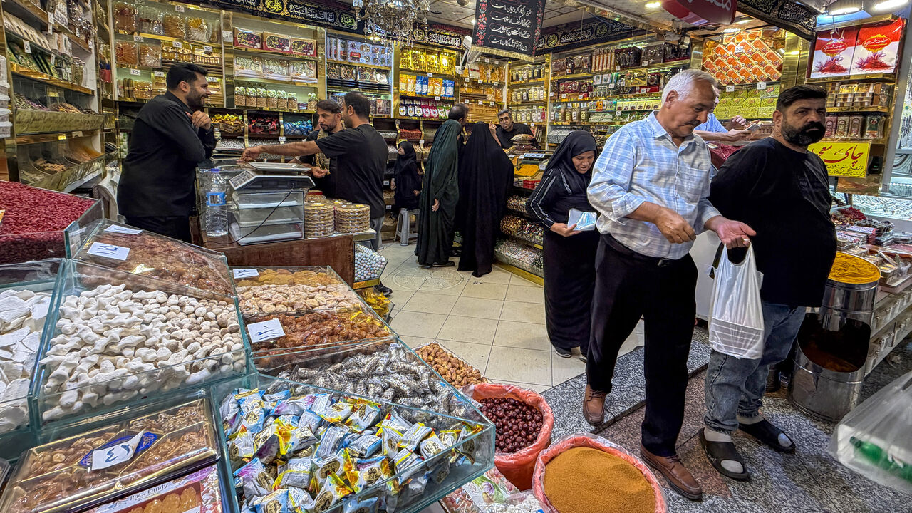 People shop at a store in the Grand Reza Bazaar near the shrine of Imam Reza following the funeral of slain Iranian leader Ali Khamenei and his family members in Mashhad on July 10, 2026. 