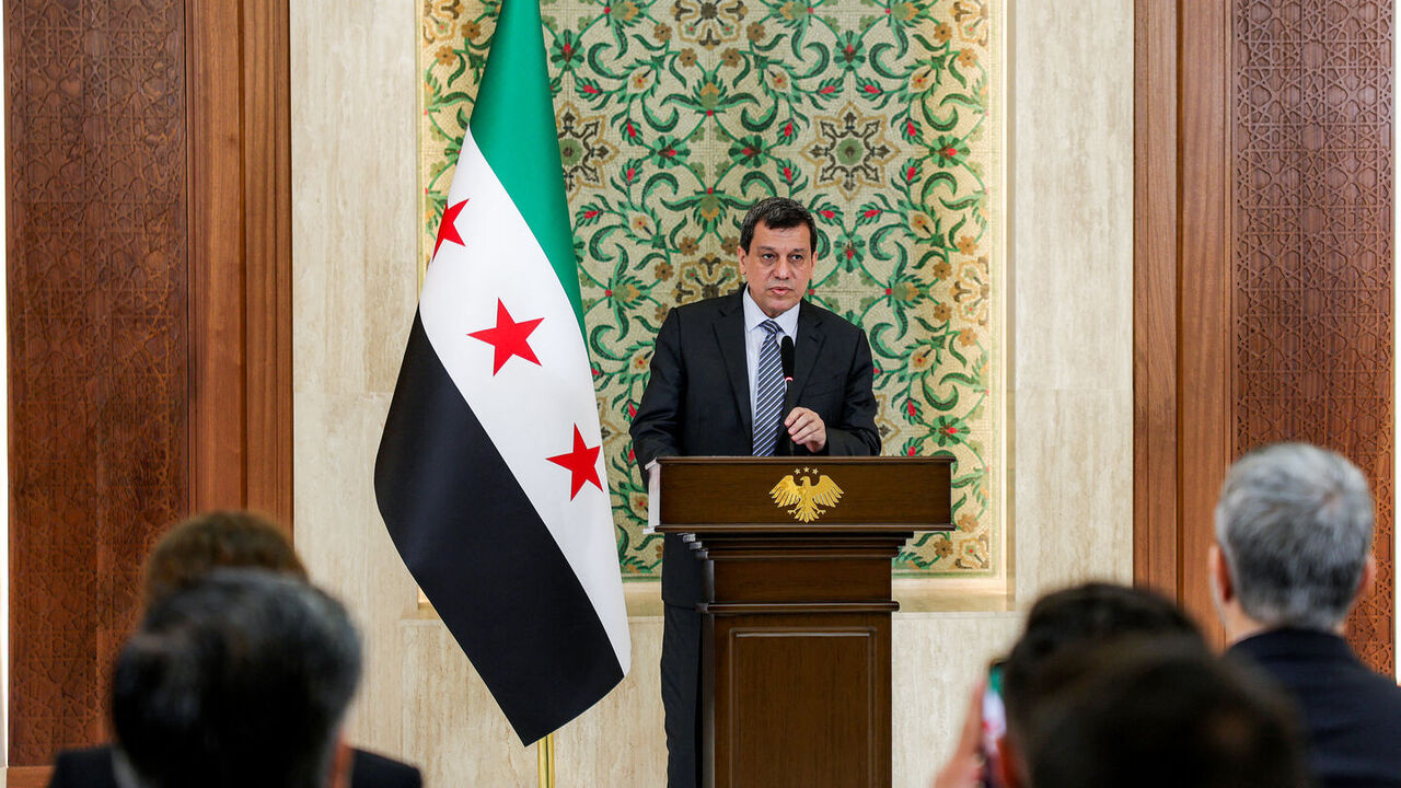 Mazlum Kobane, leader of the Kurdish-led Syrian Democratic Forces, speaks during a televised speech at the People's Palace in Damascus on Aug. 25, 2026. — Bakr ALkasem / AFP via Getty Images