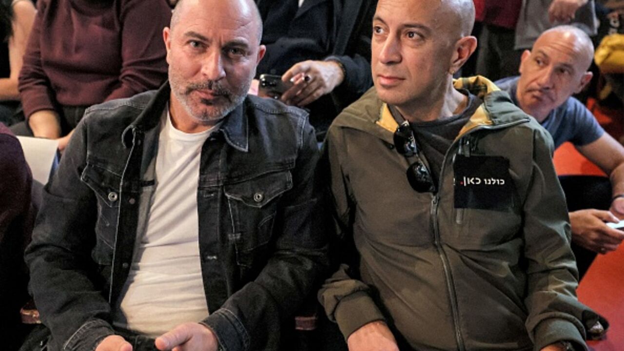  ISRAEL-ENTERTAINMENT-TELEVISION-POLITICS-GOVERNMENT-MASS-MEDIA-D (L to R) Lior Raz and Avi Issacharoff, co-creators of the hit Israeli TV show "Fauda", attend a demonstration against the Israeli government's plans to shut-down public broadcaster KAN, in Israel's Mediterranean coastal city of Tel Aviv on January 25, 2023. (Photo by JACK GUEZ / AFP) (Photo by JACK GUEZ/AFP via Getty Images)