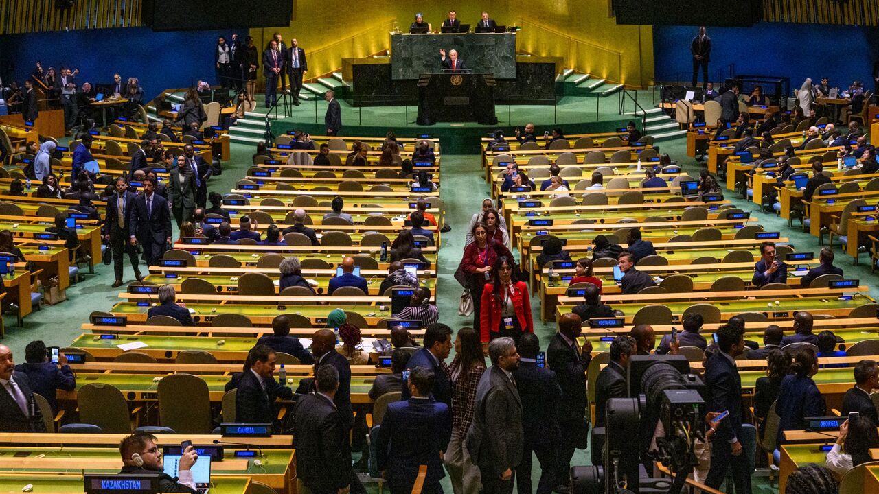 Prime Minister of Israel Benjamin Netanyahu waves to delegates leaving before his UN speech