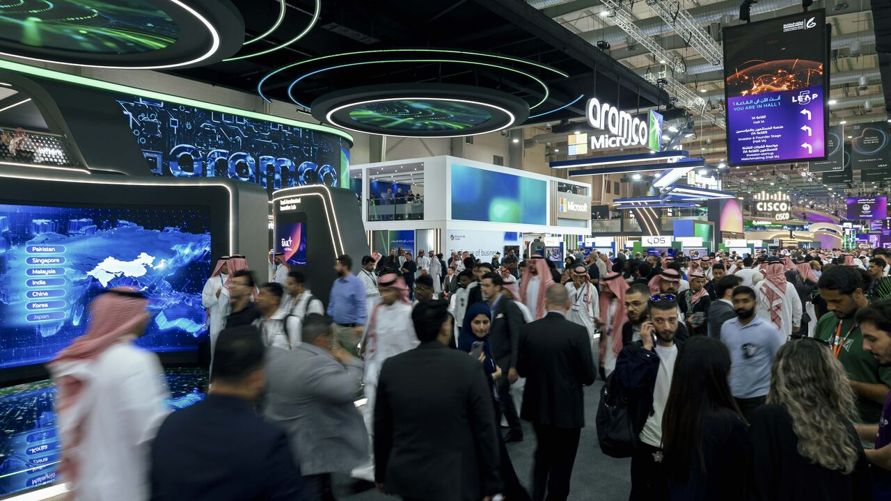 Attendees walk through the exhibition hall at the LEAP 2026 technology conference in Riyadh, Saudi Arabia, Aug. 31, 2026. — LEAP