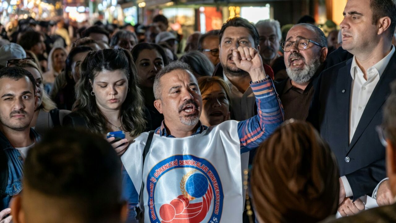 On the eve of the defection of Izmir Mayor Cemil Tugay, protesters gathered in the city chanting angry slogans against him
