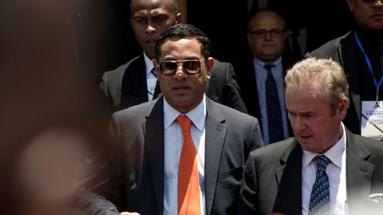 Mamy Ravatomanga (centre) is detained in Mauritius and faces money laundering accusations