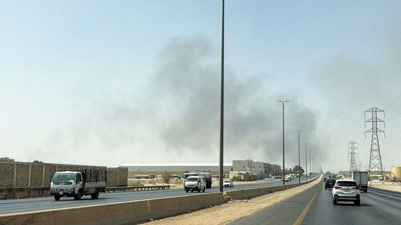 Smoke rises from a fire at the Aramco refinery south of Riyadh