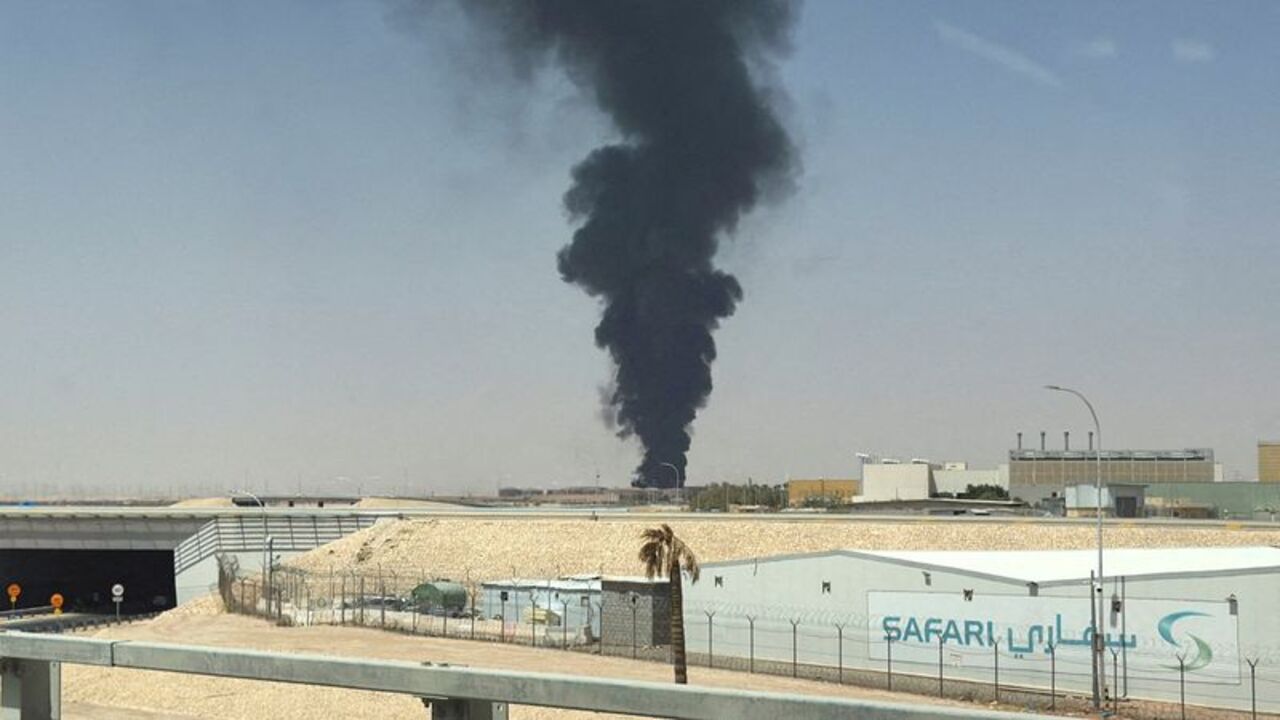 FILE PHOTO: Large plume of black smoke rises from the fuel storage area at King Khalid International Airport, in Riyadh